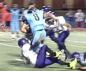 Chapin QB Seth Gonzalez readies to launch himself into the end zone for his third touchdown to seal the Huskies' first win of the season, 26-14, over the Burges Mustangs to open District 1-4A play